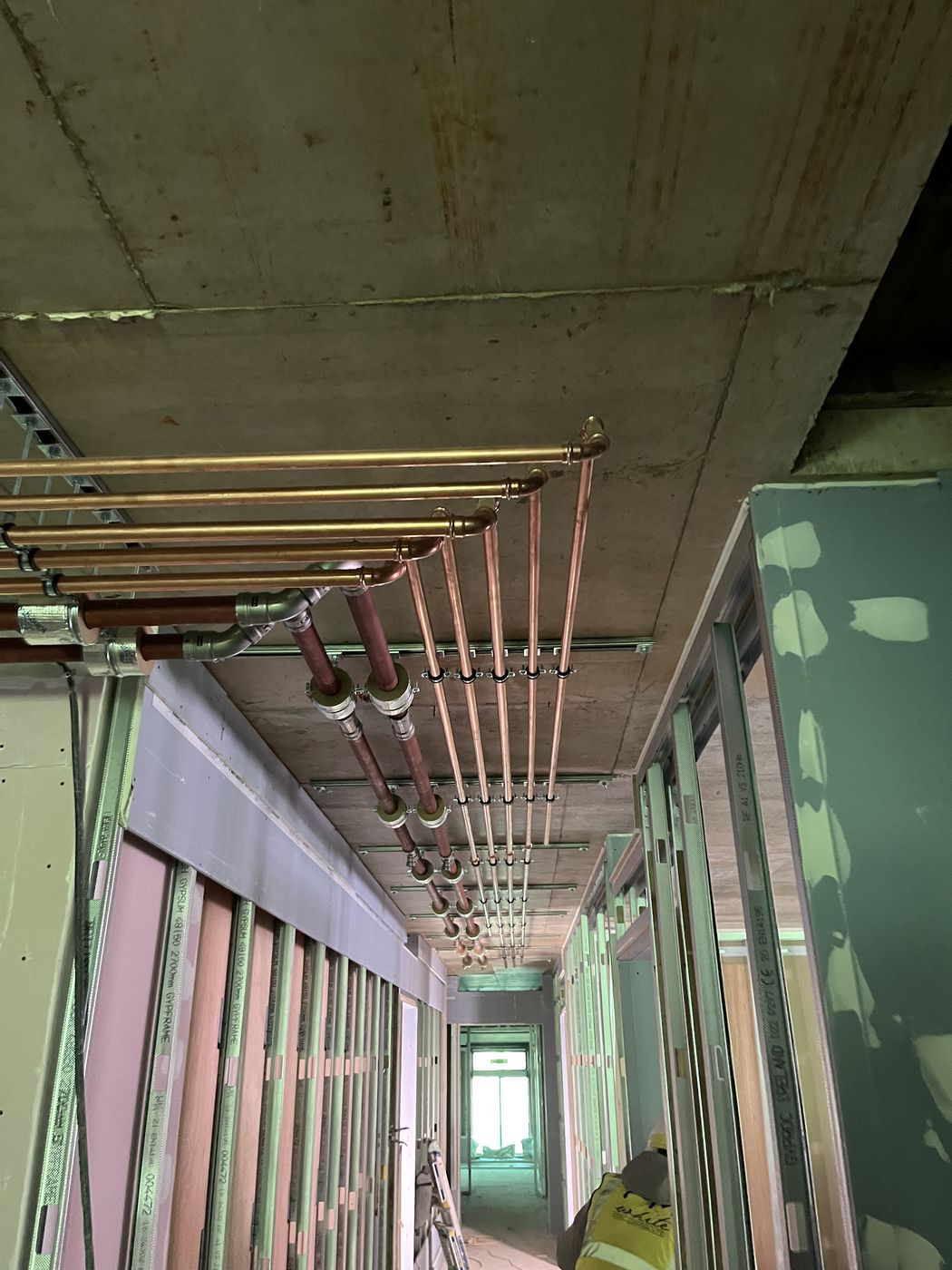 Riser pipework through communal corridor