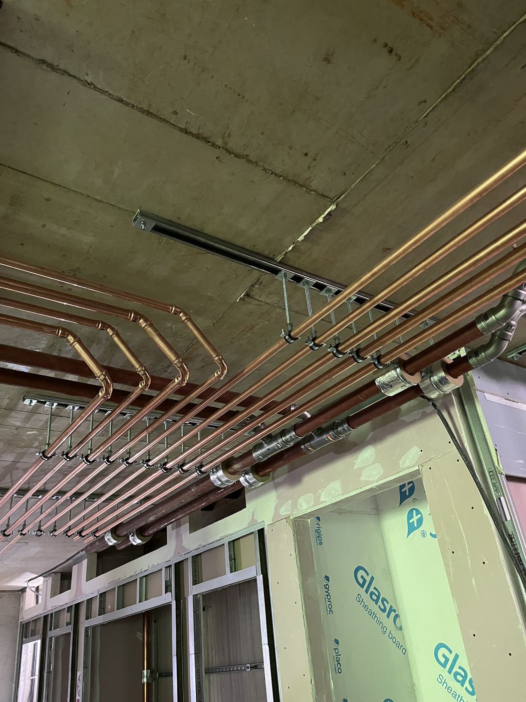 Branch pipework feeding apartment risers
